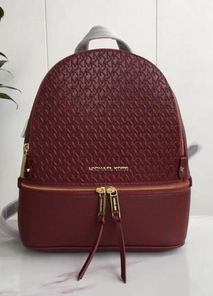 Женский кожаный рюкзак michael kors rhea zip g bordeaux lux