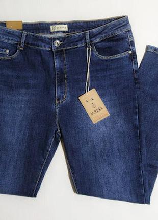 Женские синие джинсы на байке большого размера1 фото