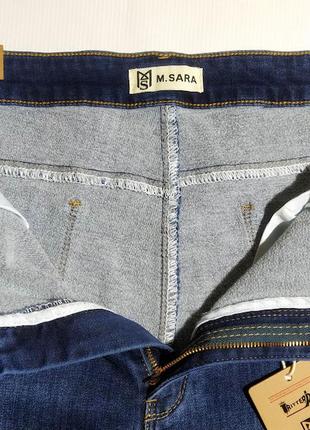 Женские синие джинсы на байке большого размера4 фото