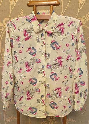 Очень красивая и стильная брендовая блузка в рисунках.