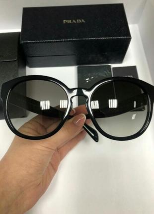 Женские солнцезащитные очки prada spr 03m черного оттенка3 фото