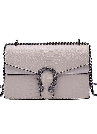 Женская классическая сумка рептилия с железной подковой белая