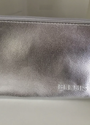 Серебристая фактурная плотная косметичка люкс бренда elemis