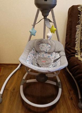 Крісло качалка заколихуючий центр