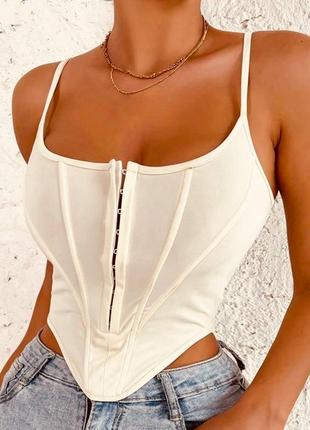 Бежевий корсетний топ з декольте на гачках