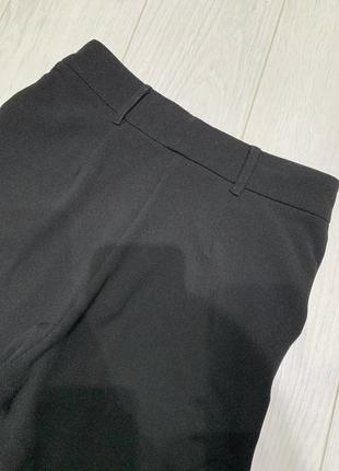 Крутые женские стильные черные штаны клеш от колен с разрезами внизу8 фото