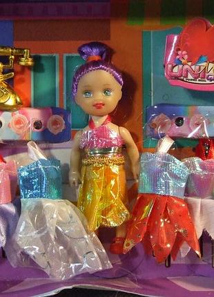 Дитяча лялька з платтячками uni que. кукла с одежками