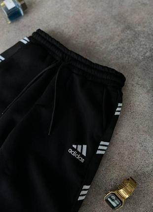 Чоловічі зимові спортивні штани adidas чорні на флісі з лампасами адідас5 фото