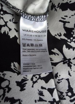 Чорні вузькі штани 7/8 warehouse в білі квіти квіточка принт квіти7 фото