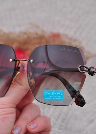 Фирменные солнцезащитные безоправные  очки  rita bradley polarized rb9001