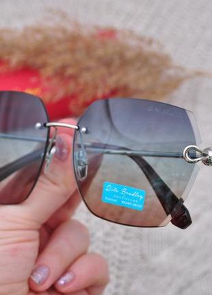 Фирменные солнцезащитные безоправные  очки  rita bradley polarized rb9001