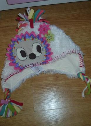 Яскрава шапочка від некст, в новому стані