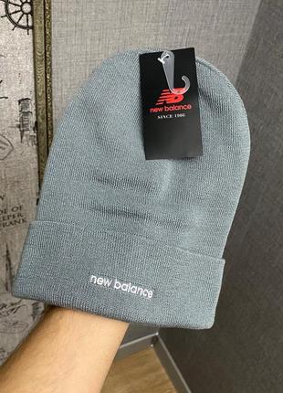 Сіра шапка від бренда new balance1 фото