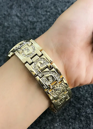 Женские золотистые часы с кристаллами код 6054 фото