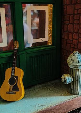 Миниатюра из сериала друзья. кофейня " central perk"