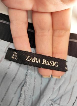 Брюки жіночі блакитні в принт з кишенями від бренду zara basic m5 фото