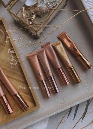 Charlotte tilbury beauty highlighter wand жидкий хайлайтер для лица и тела1 фото