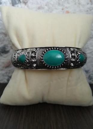 Браслет жорсткий на пружині під срібло