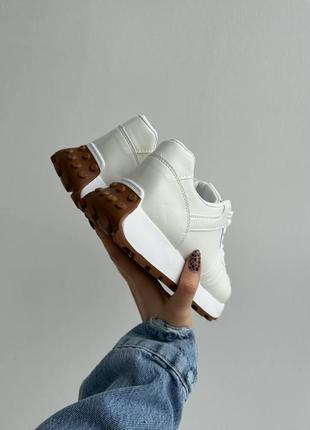 Білі кросівки6 фото