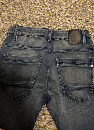 Оригинальные качественные стрейчевые темные джинсы с регулируемым обхватом талии s m9 фото