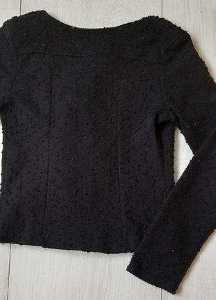 Пиджак черный, с длинными рукавами, без подкладки, на замок сбоку.7 фото