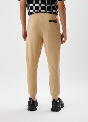 Чоловічі спортивні штани john richmond бежевого кольору.2 фото