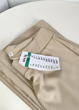 Бежеві розкльошені штани в рубчик sinsay еластичні штани з високою талією8 фото