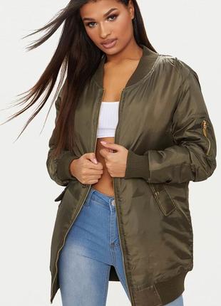 Удлиненный стеганный женский бомбер цвета хаки