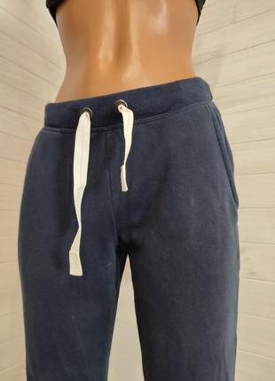 Теплые на флисе спортивные штаны на манжетах,с 2 кармашками8 фото