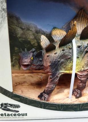 Динозавр стегозавр із планети динозаврів у натуральному кольорі2 фото