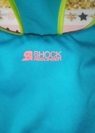 Голубой спортивный бюстгальтер топ фирмы shock absorber размер l4 фото