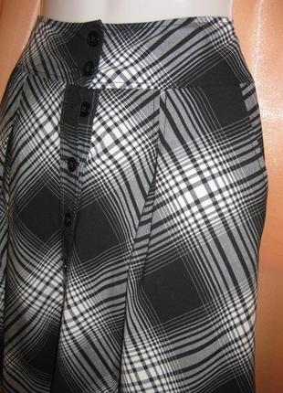 Модна зручна міді об'ємна спідниця в клітинку h&m км1549 з двома глибокими карманами по бокам8 фото