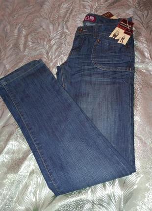 Нові жіночі джинси із заклепками кльош розмір 29. chuand tian nu10 фото