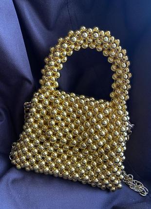 Золотая сумочка из бусин1 фото