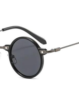 Сонцезахисні окуляри круглі, чорні в пластиковій та металевій оправі