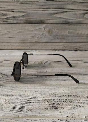 Сонцезахисні окуляри круглі, чорні в пластиковій та металевій оправі4 фото
