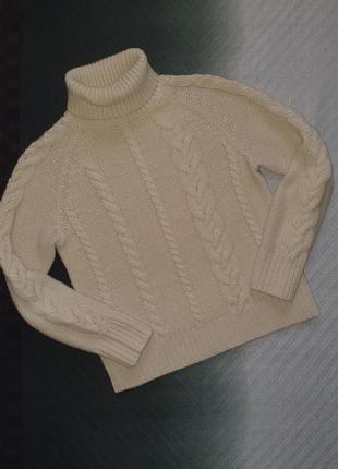 Кремовий светр косиця