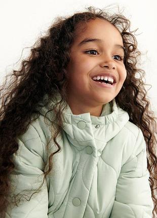 Подовжене стьобане пальто