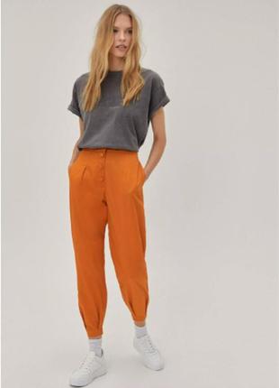 Оранжевые хлопковые брюки1 фото