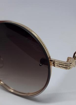 Женские в стиле cartier солнцезащитные очки круглые коричневые с градиентом в золотом металле3 фото