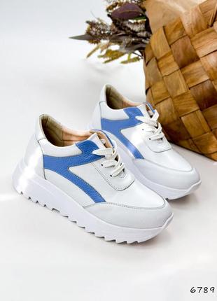 Натуральні шкіряні білі кросівки з блакитними вставками2 фото