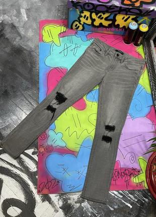 Завужені стрейч джинси з рваними колінами (waven)