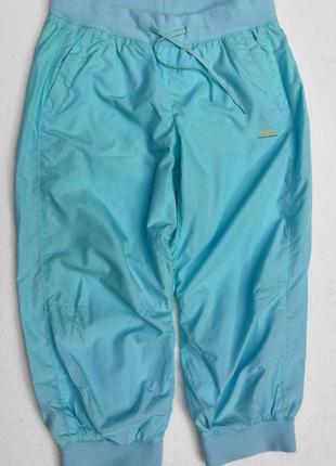 М'ятні спортивні бриджі з сіточкою всередині