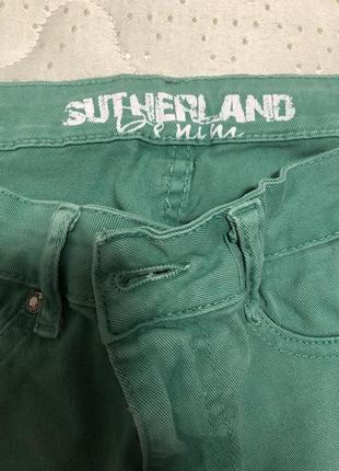 Зелені джинси штани завужені
