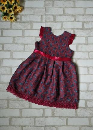 Нарядное бордовое платье с цветами на девочку