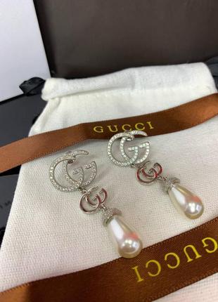 Срібні брендові сережки з цирконами та перлами майоражу, є логотип, люкс якість!5 фото