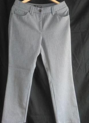 Хорошие  женские брюки на карманах со стразиками3 фото