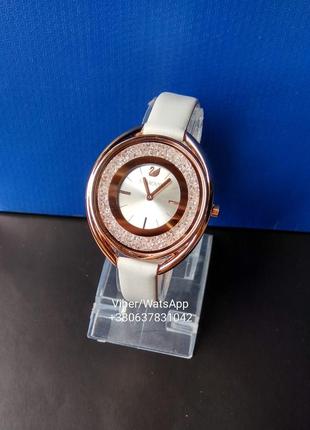 Женские часы swarovski с белым ремешком (роз.золото)8 фото