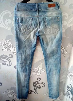 Голубые рваные зауженные джинсы ltb7 фото