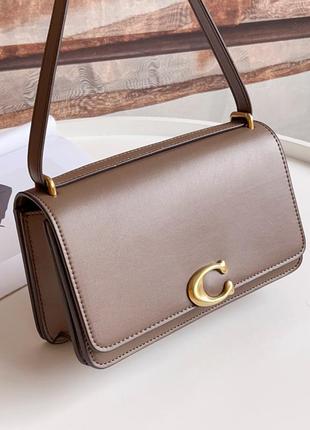 Продам сумку coach bandit shoulder 23